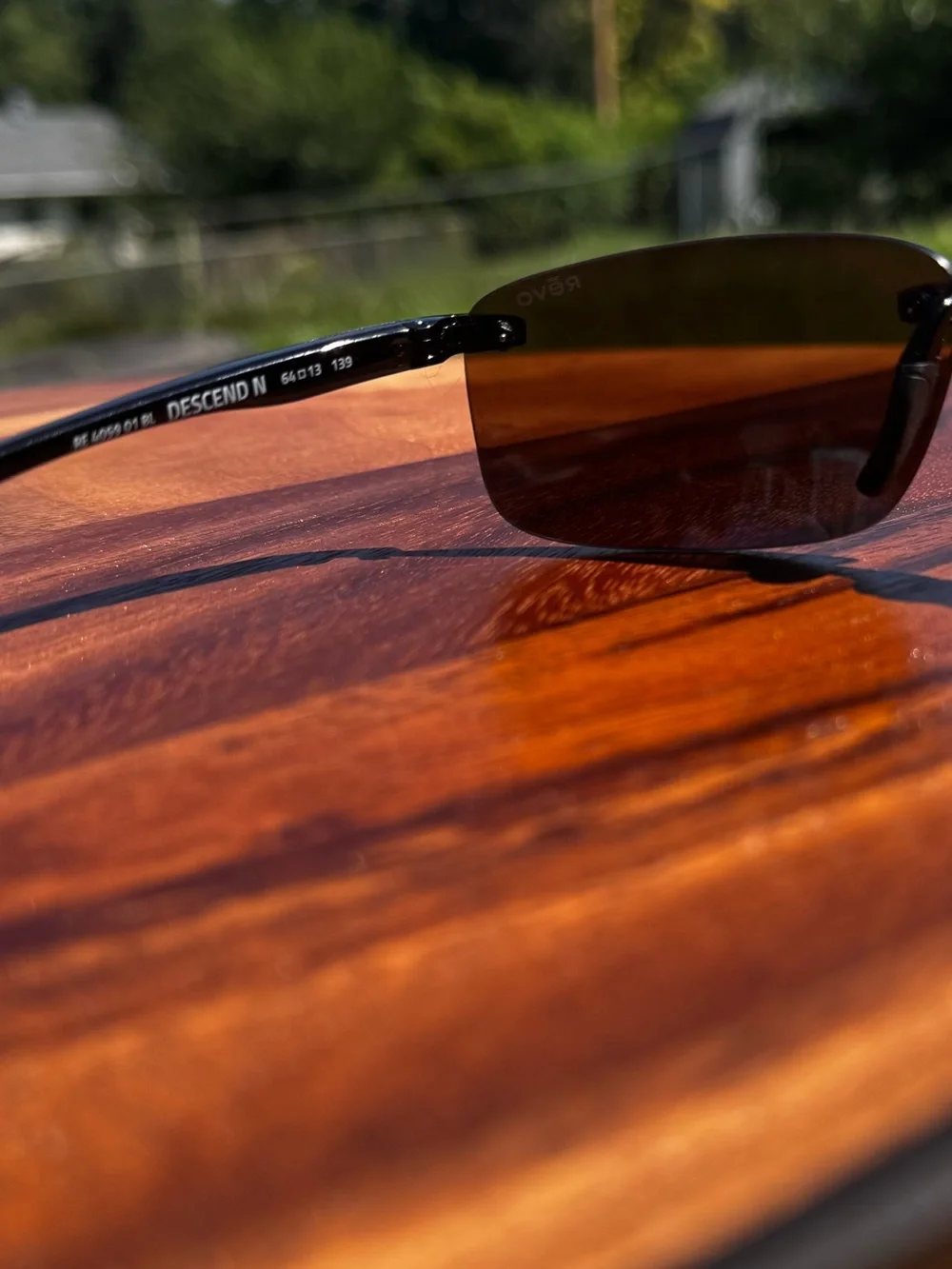 Revo Descend N RE 4059 Polarized Rimless Wrap Sunglasses Black Frame Blue Lens
